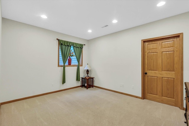 carpeted empty room with recessed lighting and baseboards