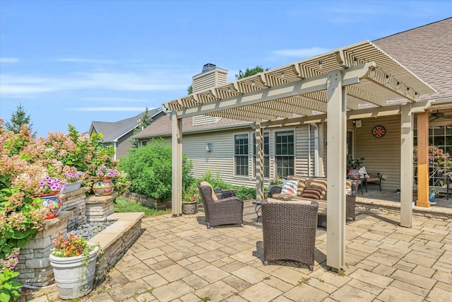 view of patio featuring outdoor lounge area and a pergola