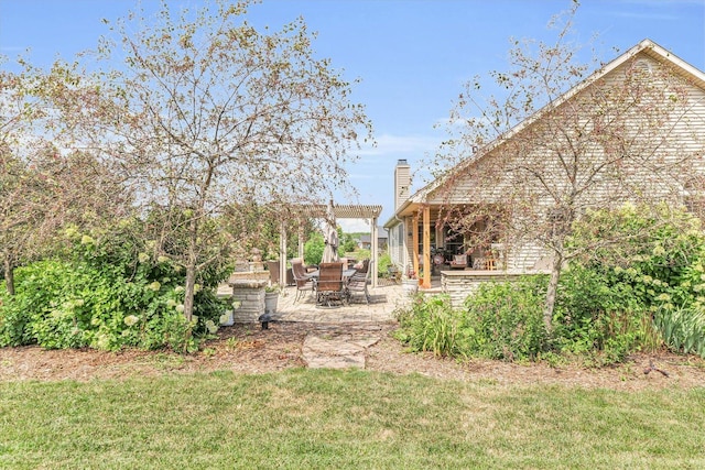 view of yard featuring a pergola and a patio