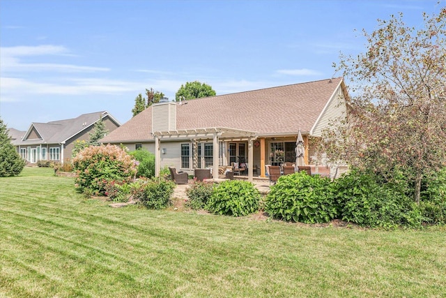 back of property with a shingled roof, a chimney, a yard, a patio area, and a pergola