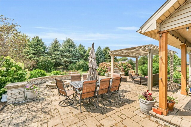 view of patio with an outdoor hangout area, outdoor dining space, and a pergola