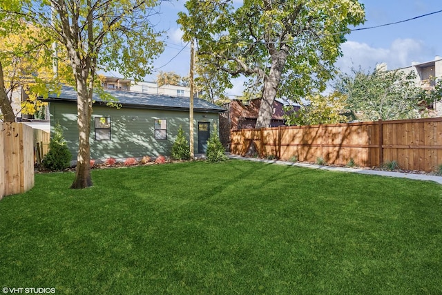 view of yard with a fenced backyard