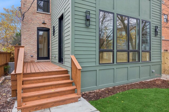 entrance to property featuring fence