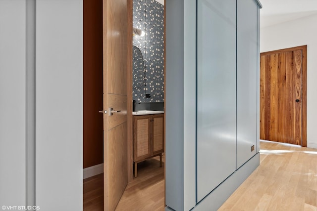 hallway with light wood-style floors