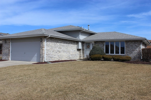 view of front of property with driveway, an attached garage, a front lawn, and a shingled roof