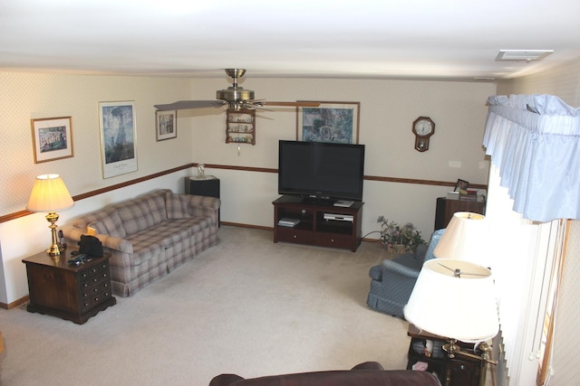 living area with visible vents, ceiling fan, carpet flooring, and wallpapered walls