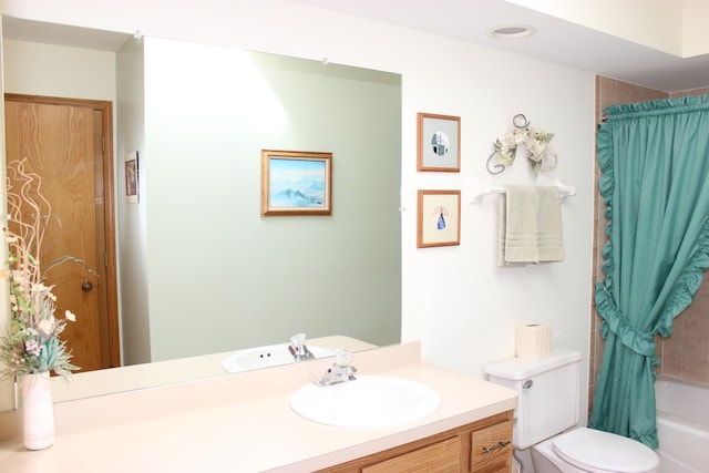 bathroom featuring shower / bath combo with shower curtain, toilet, and vanity