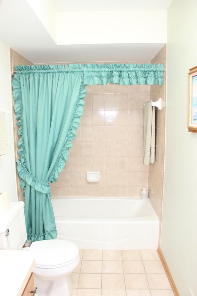 bathroom featuring vanity, baseboards, tile patterned flooring, shower / bath combination with curtain, and toilet