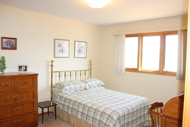 bedroom with light colored carpet