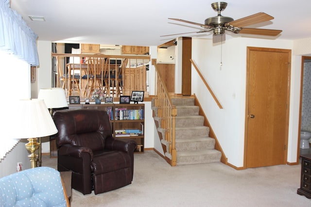 living area with stairs, carpet flooring, baseboards, and visible vents