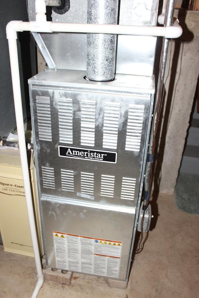 utility room with heating unit