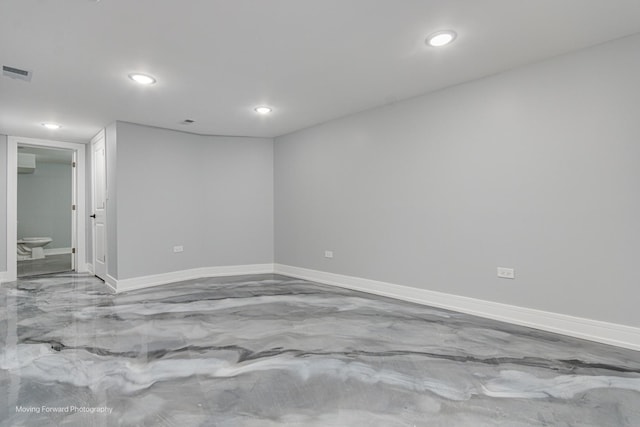 empty room with visible vents, recessed lighting, and baseboards