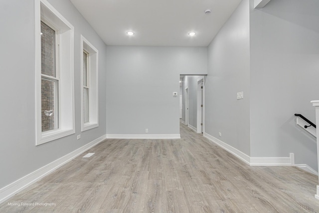 unfurnished room featuring light wood-style flooring, recessed lighting, and baseboards