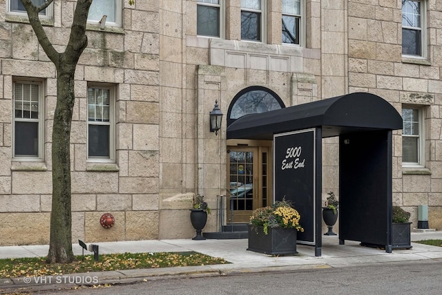 view of exterior entry with stone siding