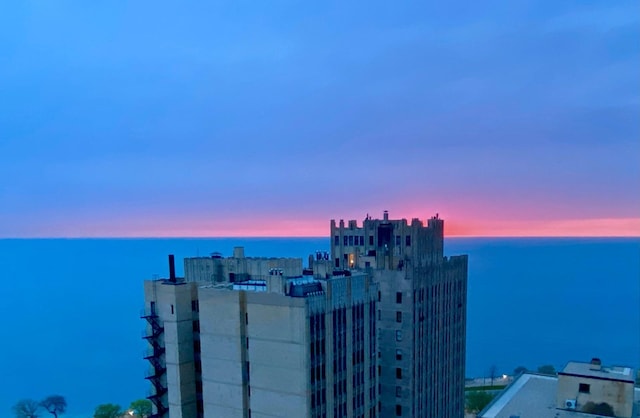 aerial view at dusk with a water view