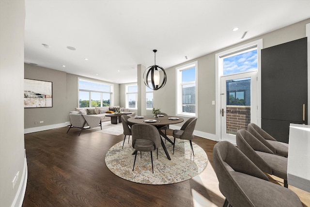 dining room with recessed lighting, baseboards, and wood finished floors