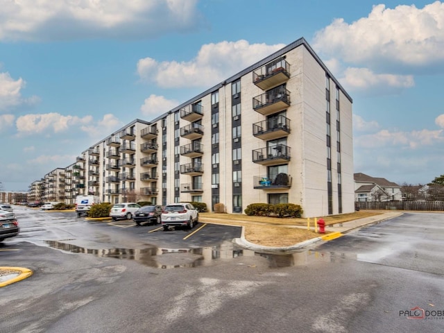 view of property featuring uncovered parking