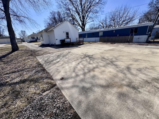 view of side of home with driveway