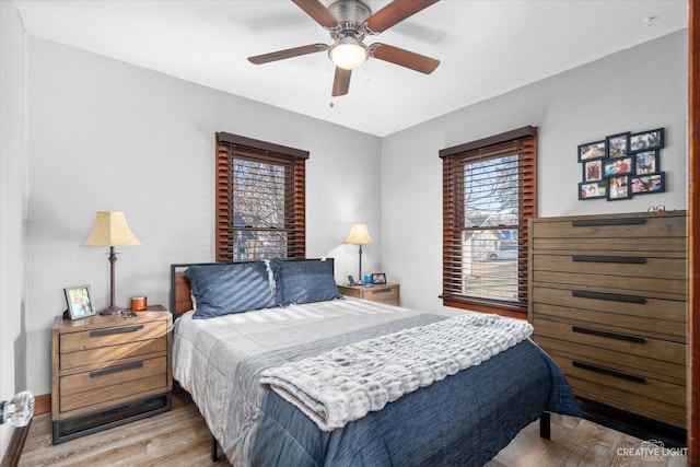 bedroom featuring a ceiling fan and light wood-style floors