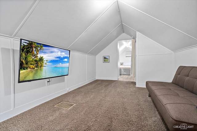 additional living space featuring visible vents, carpet floors, and vaulted ceiling