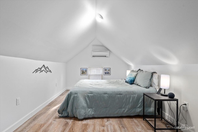 bedroom with baseboards, a wall mounted air conditioner, lofted ceiling, and wood finished floors