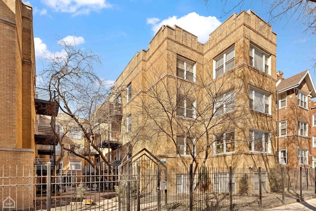 view of building exterior with a fenced front yard