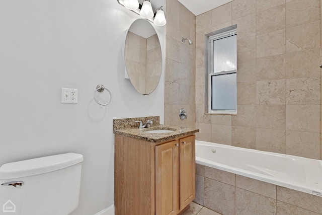 full bathroom featuring vanity, toilet, and tiled shower / bath