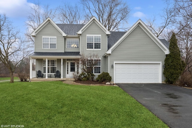 traditional-style house with a porch, a front yard, roof with shingles, a garage, and driveway