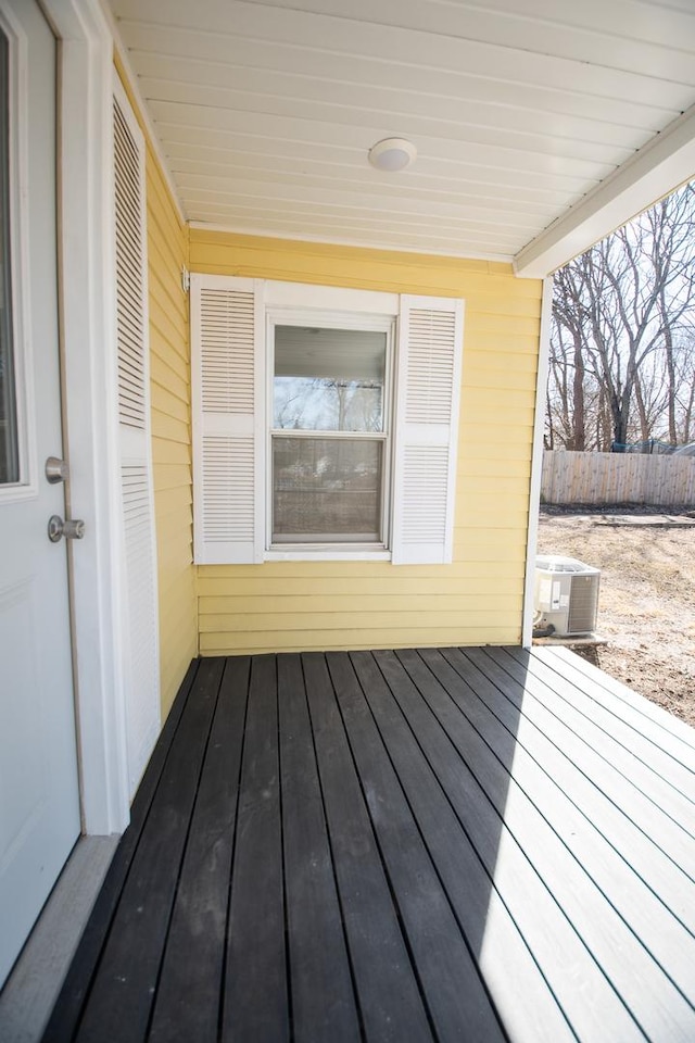 wooden deck with central AC and fence