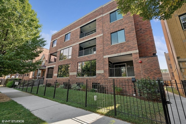 view of building exterior with fence