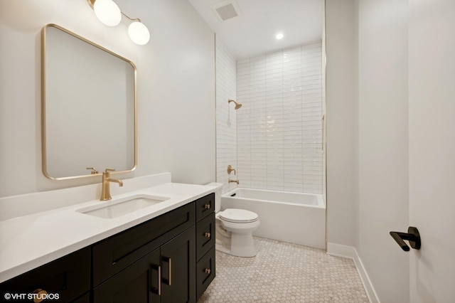 full bath with tile patterned floors, toilet, vanity, baseboards, and shower / bathtub combination