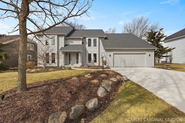 view of front of property with board and batten siding, a garage, roof with shingles, a front yard, and concrete driveway