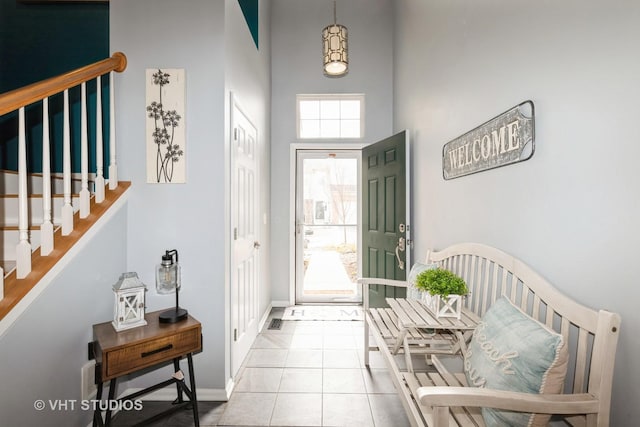 3414 Blue Ridge Dr Unit 3414, Carpentersville, IL 60110 - tiled entryway with stairway, a high ceiling, and baseboards