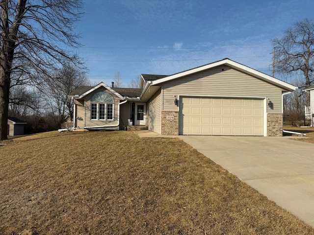 single story home with brick siding, a garage, concrete driveway, and a front yard