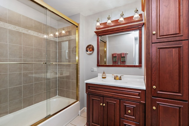 full bathroom with tile patterned flooring, vanity, and enclosed tub / shower combo