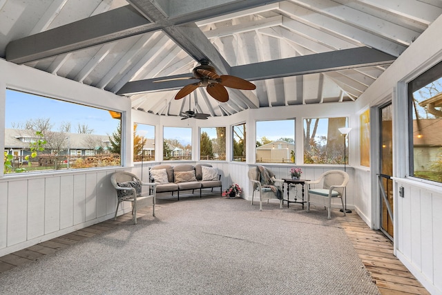 unfurnished sunroom with lofted ceiling with beams and a ceiling fan