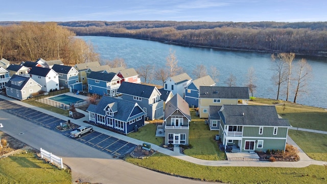 birds eye view of property with a residential view and a water view