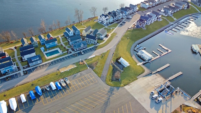 birds eye view of property with a residential view and a water view