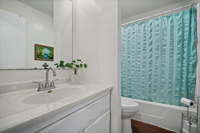 full bathroom with vanity, toilet, wood finished floors, and shower / bath combo