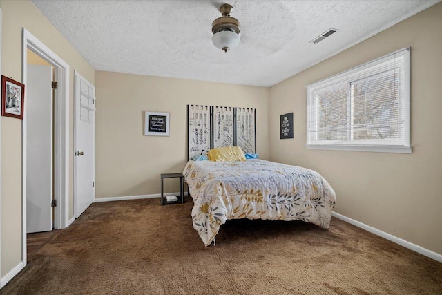 bedroom featuring visible vents, baseboards, and carpet floors