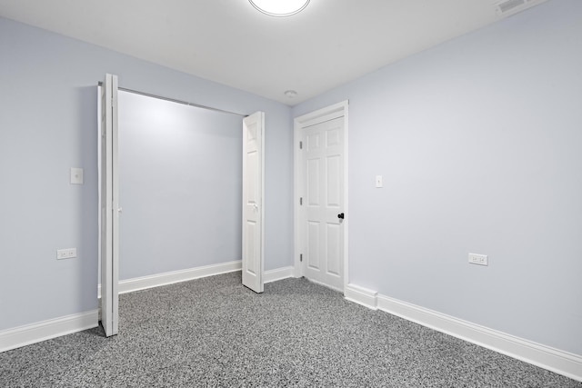 unfurnished bedroom with baseboards and carpet floors