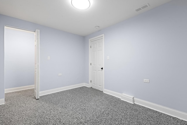 unfurnished bedroom with visible vents, carpet floors, and baseboards