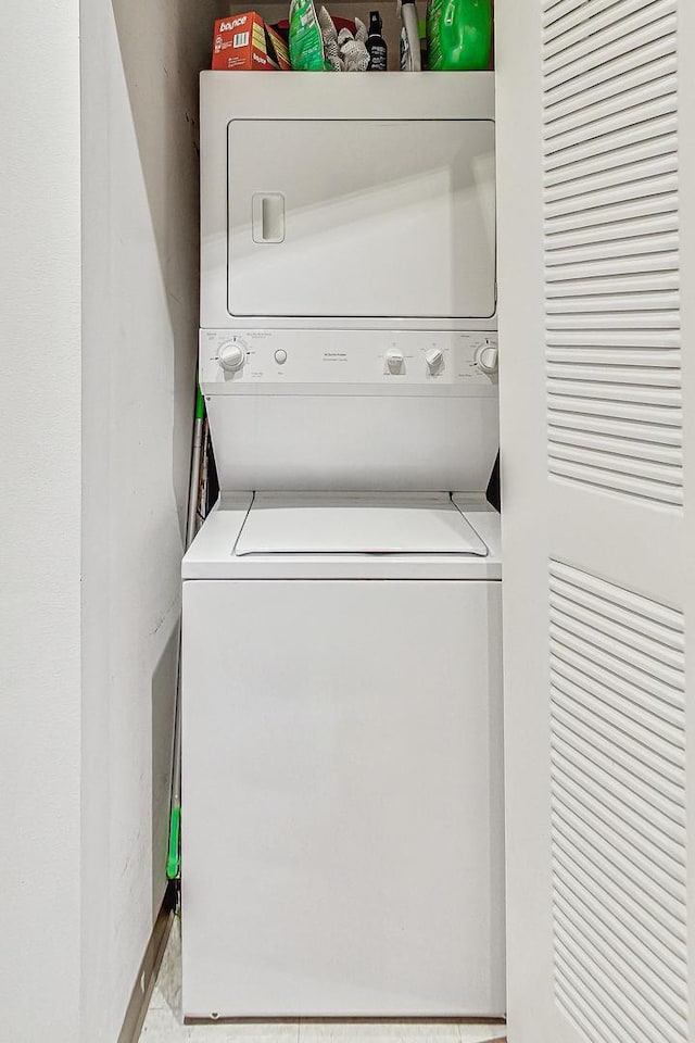 laundry area with laundry area and stacked washer and dryer