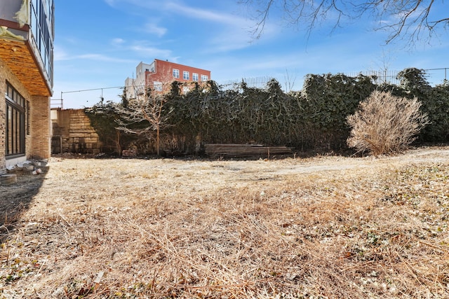 view of yard featuring fence