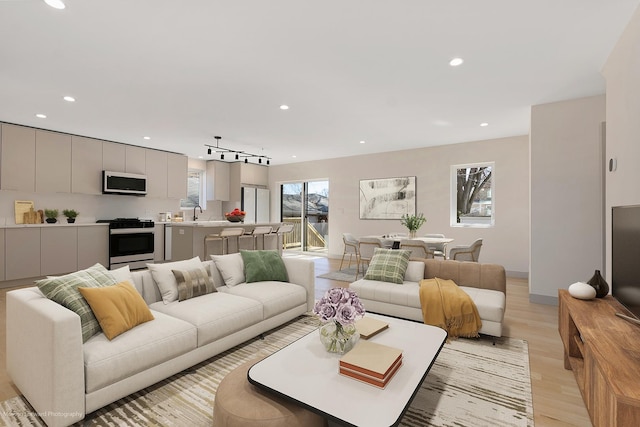 living room featuring recessed lighting and light wood finished floors