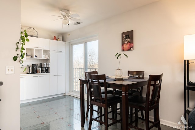 dining area with visible vents, a ceiling fan, baseboards, and marble finish floor