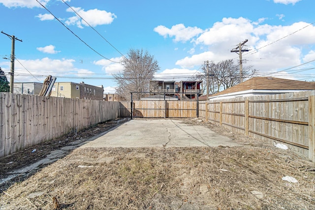 view of yard with a patio and a fenced backyard