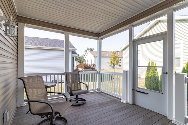 sunroom / solarium with a residential view