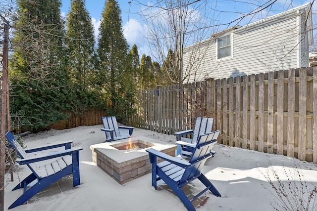 view of patio with fence and an outdoor fire pit