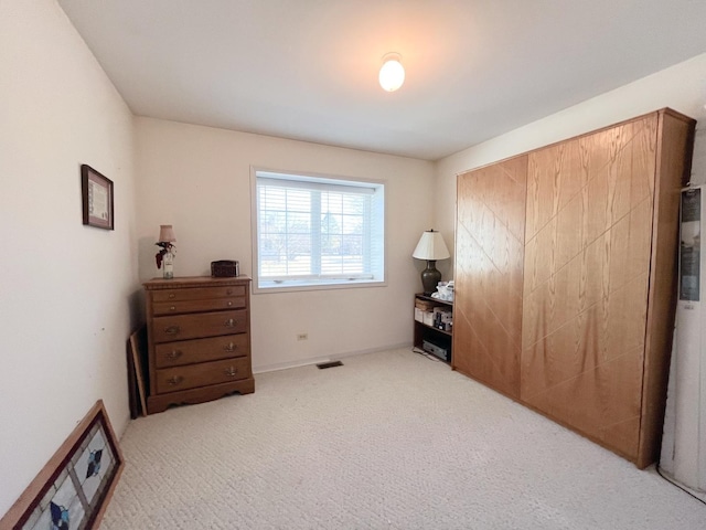 interior space featuring visible vents and carpet